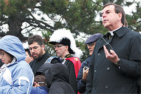 Children and adults join Archbishop Allen Vigneron as he leads about 500 pro-life demonstrators in prayer last Saturday. 